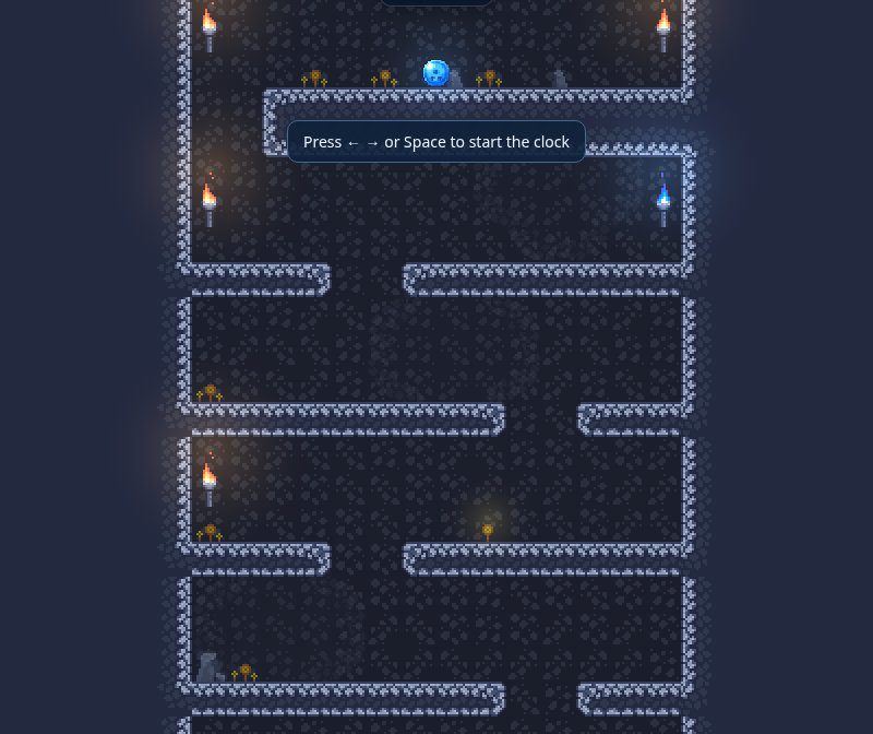 Drople in a browser: a blue ball at the top of a tall pixel-art cave level with torches and stone ledges, and the hint 'Press left, right or Space to start the clock'